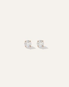 Crafted from recycled 14K yellow or white gold and ethically sourced natural diamonds, these solitaire studs are perfect for everyday wear and special occasions, too. The diamonds are carefully selected for exceptional beauty and meticulously set for a timeless, heirloom-quality design.  | Quince | Women's 14k Gold Natural Diamond Solitaire Studs in Yellow Gold Everyday White Diamond Earrings With Prong Setting, Minimalist White Diamond Earrings With Brilliant Cut, Everyday White Diamond Earrings, White 14k Gold Single Diamond Earrings, Everyday White Diamond Earrings With Single Diamond, Minimalist Solitaire Diamond Earrings, Minimalist White Diamond Earrings With Single Diamond, Minimalist White Diamond Earrings With Single Stone, Everyday White Single Diamond Earrings