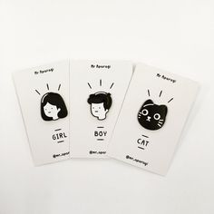 three brooches with cats on them sitting next to each other in front of a white background