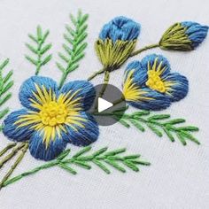 an embroidered flower with blue and yellow flowers