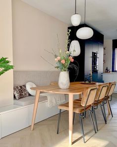 a wooden table sitting in the middle of a living room