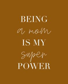 the words being a mom is my super power on a brown background with white lettering