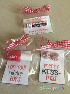 three packaged candy bags with tags attached to them