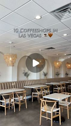 the inside of a restaurant with tables and chairs