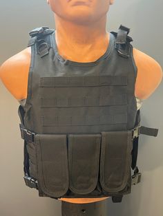 a mannequin's torso wearing an army vest