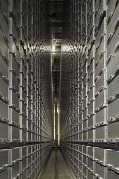 the inside of a large storage room filled with lots of metal boxes