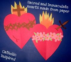 two paper hearts with crosses and flowers on them, one has the words sacred and immacculate hearts made from paper