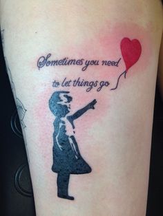 a girl with a heart shaped balloon tattoo on her arm that says sometimes you need to let things go