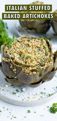 baked artichokes on a plate with parsley sprinkled over them