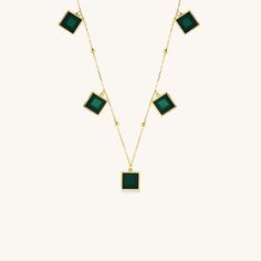 The Geometric Emerald Necklace is a bold and sophisticated statement piece, designed to capture attention and admiration. Crafted from high-quality gold vermeil, this necklace features a striking geometric design that is both modern and timeless. The centerpiece of the necklace is a vibrant emerald stone, showcasing its rich green color and natural beauty. Weighing 8.61 grams, this necklace provides a substantial feel without compromising on comfort, making it suitable for all-day wear. The Geom Modern Formal Emerald Jewelry, Modern Green Jewelry For Formal Occasions, Modern Yellow Gold Emerald Jewelry, Modern Emerald Jewelry In Yellow Gold, Modern Yellow Gold Necklace With Gemstone, Minimalist Emerald Necklace For Formal Occasions, Modern Green Emerald Jewelry, Minimalist Formal Emerald Necklace, Modern Green Necklace For Formal Occasions