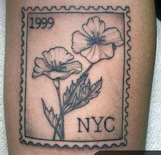 a stamp with two flowers on it and the word nyc written in black ink is shown