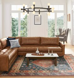 a living room filled with furniture and lots of windows