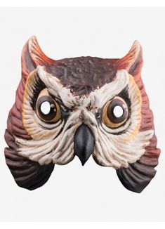 an owl mask with big eyes and long horns on it's head is shown in front of a white background