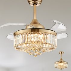 a gold ceiling fan with crystal chandelier hanging from it