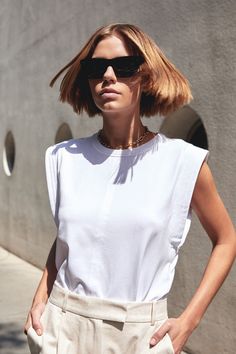 The Gimme That Shoulder Tee in White – Sold Out NYC Fitted White Effortless Tops, White Fitted Effortless Tops, White Fitted Effortless Style Tops, Effortless Fitted White Tops, Effortless White Fitted Tops, Chic Cotton Crop Top For Everyday, Summer Crop Top Muscle Tee, Effortless Summer Crop Top, White Muscle Tee For Everyday Summer Wear