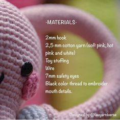 a pink crocheted stuffed animal with numbers on it's face and back