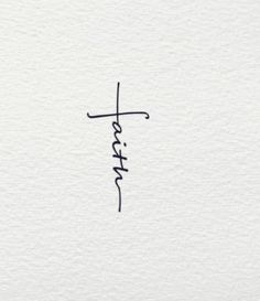 the word faith written in cursive writing on white paper with a black ink pen