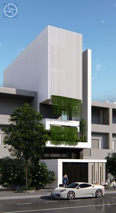 a white car parked in front of a tall building with plants growing on it's side