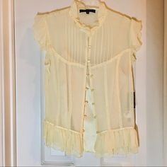 Sheer Silk Blouse In Pale Yellow, With Its Own Satin Silk Camisole. Feminine Details Galore, Including Ruffles , Satin Trims, A Pin Tucked Bib, Lace Trim, And Flutter Sleeves. Size Xs, Nwt Cream Formal Top For Summer, Elegant Yellow Summer Blouse, Elegant Yellow Formal Tops, Classic Fitted Sleeveless Blouse, Elegant Yellow Fitted Top, Elegant Fitted Yellow Tops, Feminine Fitted Yellow Blouse, Elegant Yellow Silk Top, Fitted Yellow Silk Top