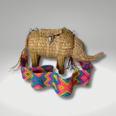 Fashioned in the shape of little elephants, mounted with buckle closures and outfitted with colorful woven shoulder straps, these handcrafted purses are the crafty creations of artisans from Mexico. Dimensions:Length: 12-11 inches.Height: 9-7 inches.Strap: 34-36 inches length. 17 inches drop approx.Hand woven Elephant Bag, Novelty Purses, Animal Bag, Camera Straps, Crafty Creations, Bag Stand, Beautiful Handbags, Mint Blue, High Point