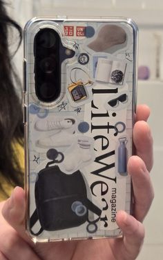 a person holding up a clear case that has various items on it and the words'little new york '