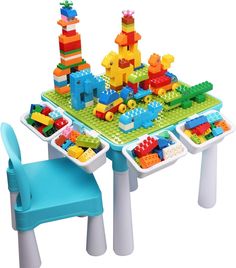 a child's table and chairs with legos on it, including a blue chair