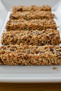 granola bars are lined up on a white plate