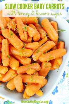 baby carrots in a white bowl with the words slow cooker baby carrots