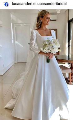 a woman in a white wedding dress holding a bouquet