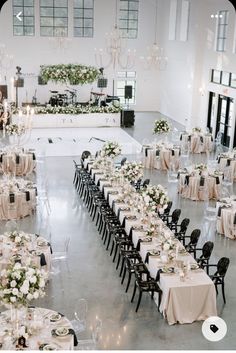 a large banquet hall with tables and chairs