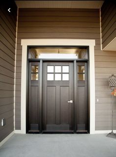 the front door of a house with a basketball hoop