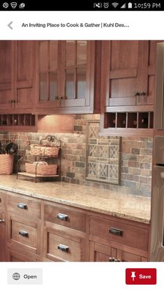 a kitchen with wooden cabinets and tile backsplash