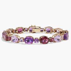 Infuse your style with sparkle as you wear this bracelet featuring gorgeous cushion- and oval-cut amethyst and rhodolite stones. The timeless gleam of the 14k yellow gold design completes the luxurious effect. Elegant Purple Multi-stone Gemstones, Luxury Yellow Gold Amethyst Bracelets, Luxury Purple Jubilee Bracelet, Elegant Amethyst Gemstone Bracelets, Elegant Amethyst Bracelets With Gemstone Accents, Elegant Purple Gemstone Bracelets, Luxury Amethyst Bracelets For Formal Occasions, Luxury Amethyst Jubilee Bracelet, Elegant Amethyst Jubilee Bracelet