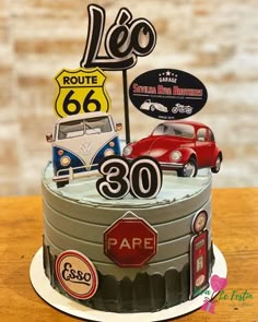 a birthday cake with cars and street signs on the top is for someone's 30th birthday