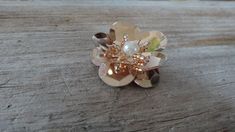 a flower ring sitting on top of a wooden table