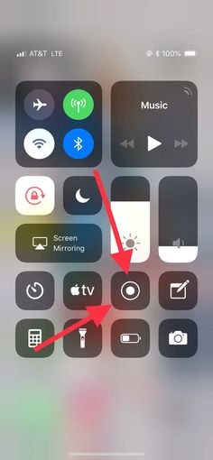 an iphone screen with the music button highlighted and arrow pointing to it's left side