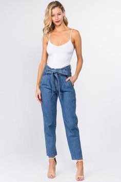 TRENDING || PREMIUM DENIM Available in light and medium wash High waisted Ankle Length Double Button with zip fly Paper bag tie waist Side & back pockets 100% Cotton No stretch 13" rise, 27" inseam Sizing: Small (0-2) : Waist 26" Hips 40" Medium (4-6): Waist 28" Hips 42" Large (8-10): Waist 32" Hips 44" Paper Bag Jeans, Fly Paper, Bag Jeans, High Rise Mom Jeans, Premium Denim, Waist Tie, Ankle Length, Levi Jeans, Mom Jeans