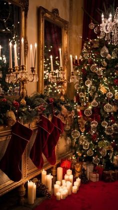 a decorated christmas tree with candles in front of it