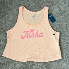 Cropped Tank Top With Aloha Written On The Front Size: L Nwt - Never Worn! Smoke Free And Pet Free Home Hollister Tops, Cropped Tank Top, Orange Pink, Crop Tank, Color Orange, Hollister, Pink And Orange, Tank Top, Womens Tops