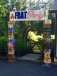 a sign that reads frat party hanging from the side of a building next to a gate