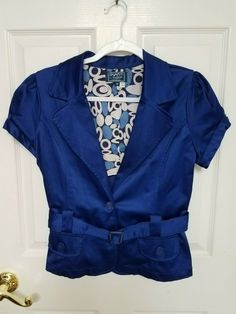 Item is in great condition. Kept in storage comes from smoke/pet free environment. Fitted Retro Blue Outerwear, Retro Fitted Blue Outerwear, Fitted Blue Button-up Outerwear, Blue Fitted Retro Outerwear, Fitted Retro Blue Blazer, Retro Fitted Blue Blazer, Blue Button-up Outerwear With Buttoned Pockets, 90s Blue Button-up Top, Blue Button-up Outerwear With Pockets