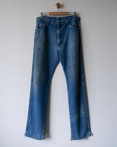 90s Vintage Wrangler Jeans Paint Distressed Made In USA 🔍 Key Features: * Wrangler Jeans * Made in the USA, 90s era, medium wash, worn in distressed look 📝 Condition: * Sold as is; has worn in look, paint stains and markings all throughout, bottom hem splits 📏 Measurements: * Waist: 17 in * Inseam: 33 in * Leg Open: 9.5 in * Thigh: 12.5 in ✨ Additional Info: * Cleaned & ready to wear right out of the box! 🧼 * Open to offers. Got questions? I'm here to help! 📬 Vintage Jeans With Medium Wash And Frayed Hem, Vintage Medium Wash Jeans With Frayed Hem, 90s Style Medium Wash Jeans With Frayed Hem, Vintage Faded Jeans With Frayed Hem, 90s Style Distressed Faded Jeans, 90s Style Distressed Denim Blue Jeans, Retro Relaxed Fit Distressed Jeans, Vintage Jeans Medium Wash With Frayed Hem, Vintage Relaxed Fit Jeans With Frayed Hem