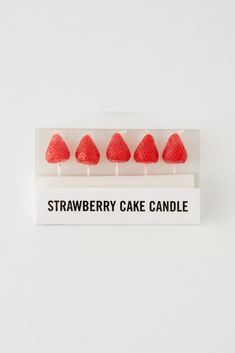 strawberry cake candle set on white background