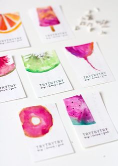 six watercolor cards with different designs on them, each one has a bite taken out of it