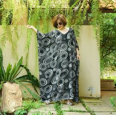 "A soft, comfy, printed light rayon maxi kaftan. A must have piece for this summer. Team this dress with sandal and a big tote to complete a casual chic, or wear it to a garden party, Sunday brunch and beach party. Material: printed light rayon Model is 161 cm. tall with 32\" bust, 28\" waist and 38\" hip Status: ready to ship weight: 315g Measurement: dress (approximately) Width: 43.5\" Bust: 65\" **can fit up to bust max 52\" Hip: 65\" **can fit up to bust max 52\" Length: 52.5\" PLEASE PROVID Printed Black Maxi Dress For Beach Season, Black Printed Maxi Dress Free Size, Black Free-size Kaftan For Spring, Casual Black Maxi Kaftan, Black Free Size Casual Kaftan, Casual Black Kaftan For Spring, Summer Casual Black Kaftan, Casual Black Spring Kaftan, Casual Black Summer Kaftan