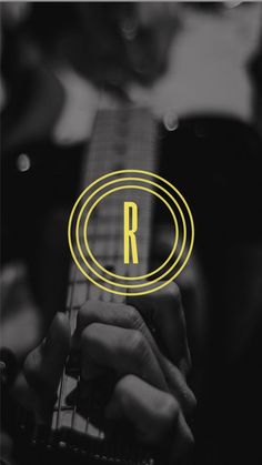 a person playing an electric guitar with the letter r in the middle and yellow circle around it