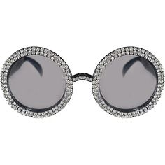 a pair of sunglasses with round frames and crystals