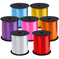 several spools of colored thread are shown in different colors and sizes on a white background