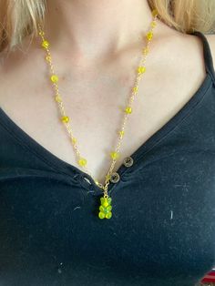 This gummy bear necklace is made from gold plated chain, has a yellow plastic pendant of a gummy bear, a variety of yellow glass beads, and is about 12 inches long with the pendant. can be customized to preferred length Trendy Gold Resin Necklace, Trendy Yellow Beaded Necklace For Gift, Gummy Bear Necklace, Bear Necklace, Gummy Bear, Gummy Bears, May 21, Gold Plated Chains, Pendant Necklaces