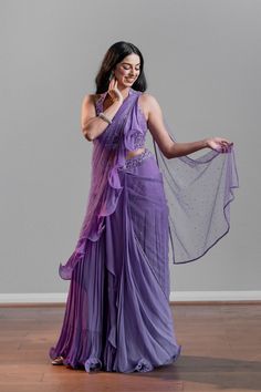 A purple lehenga ruffle saree paired with a fun halter blouse DELIVERY TIMEPlease allow 1 week for your outfit to be dispatched. FABRIC DETAILSGeorgette Professional cleaning only. Purple Lehenga, Halter Blouse, Ruffle Saree, Professional Cleaning, Wedding Board, Lehenga, Your Outfit, Saree, Purple