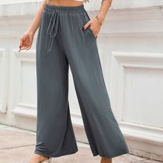 Need a cozy staple that's effortlessly stylish? These grey wide-leg jersey pants come with a decorative tie at the waist, adding a touch of elegance to your comfort wear. Perfect for lounging or casual outings, they offer a relaxed fit that moves with you. Whether you pair them with a simple t-shirt, a breezy blouse, or a casual tank top, these pants offer a relaxed and effortless style that is perfect for warm weather and laid-back summer days. Product code: CAA02D4D015BB Simple T Shirt, Grey Tie, Jersey Pants, Simple Tshirt, Comfort Wear, Fleece Joggers, Womens Fleece, Casual Tank Tops, Bottom Clothes